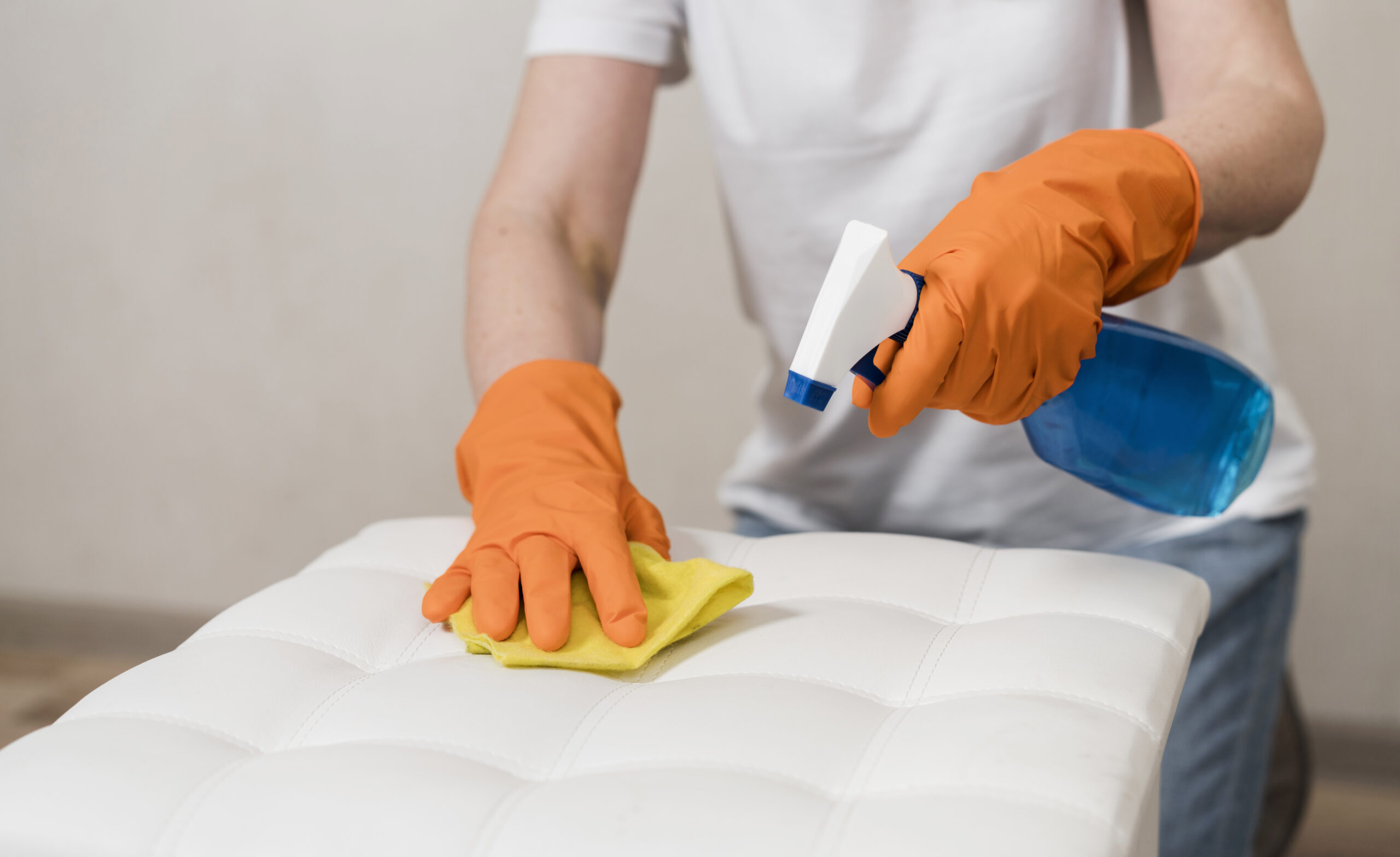 woman-with-rubber-gloves-cleaning